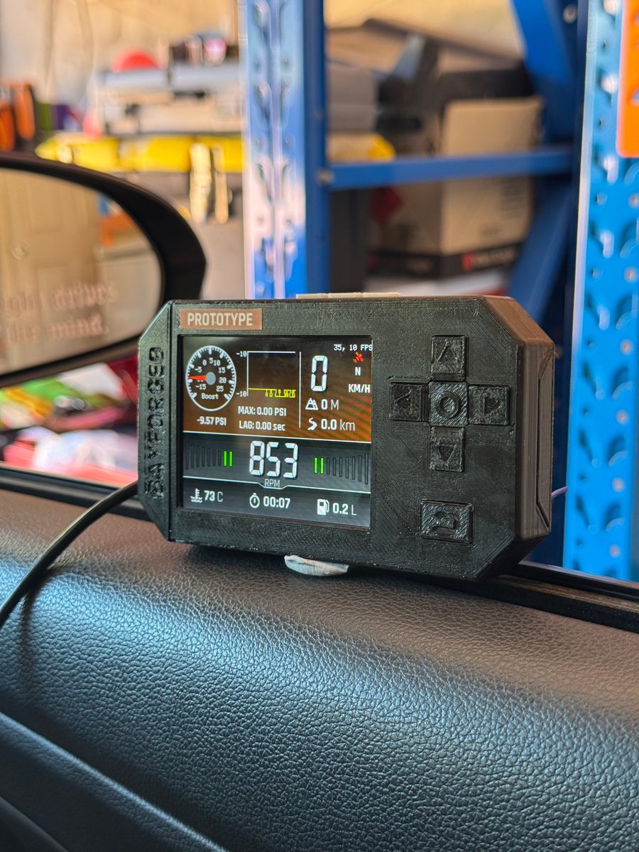 A pilot unit on a car's dash showing live engine data