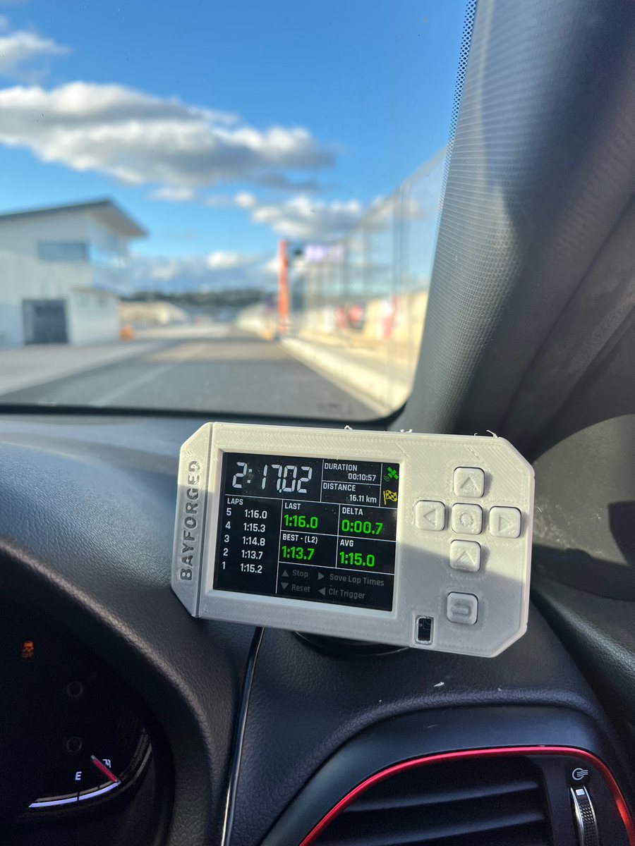 A white Anvil prototype on the dash in the pit lane at Winton Raceway, showing lap data